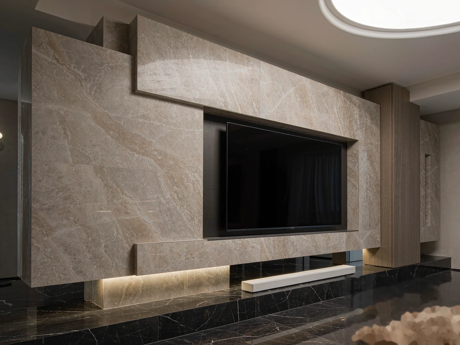 Large-format sintered stone TV feature wall with minimal joints
